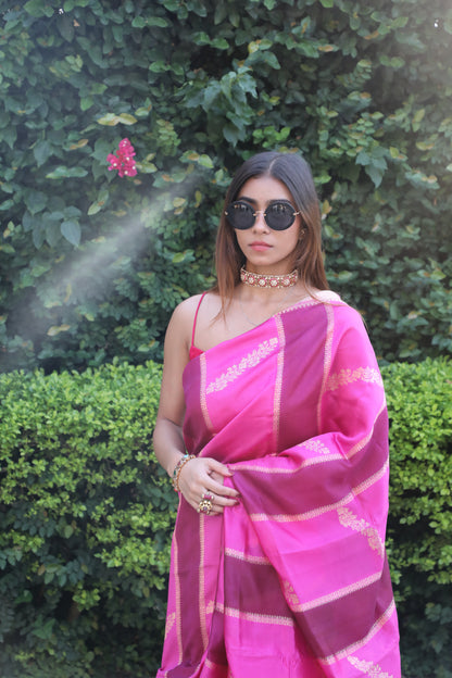 Juhi Banarasi Silk Saree in Pink Hues, Handwoven Banarasi Saree with Rangkat Technique, Elegant Pink Silk Saree with Gold Zari Work, Floral Motif Banarasi Saree for Weddings, Pure Silk Saree with Regal Gold Pallu, Traditional Banarasi Saree from Rang-e-Riwaayat Collection, Luxury Bridal Trousseau Banarasi Saree in Pink, Cultural Festive Wear Saree with Handloom Artistry, Designer Banarasi Saree with Pastel and Bold Pink Stripes, Contemporary Saree with Kadhwa Weave in Pure Silk
Juhi Saree, Banarasi Silk, Ra