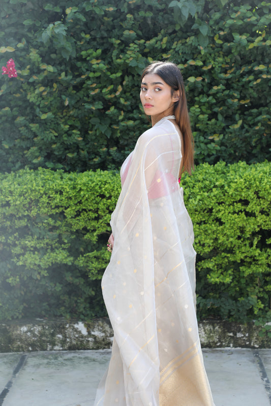 Harsingaar Saree, Silver Ivory Saree, Banarasi Tissue Silk Saree, Pure Tissue Silk Saree, Handwoven Banarasi Saree, Banarasi Tissue Saree Online, Bridal Banarasi Saree, Wedding Banarasi Saree, Festive Banarasi Saree, Heritage Banarasi Saree, Bridal Trousseau Saree, Festive Wear Saree, Party Wear Banarasi Saree, Contemporary Banarasi Saree, Luxury Saree for Wedding, Traditional Banarasi Saree, Elegant Tissue Silk Saree, Designer Banarasi Saree, Kadhwa Banarasi Saree, Silver Gold Zari Saree, Floral Motif Sare