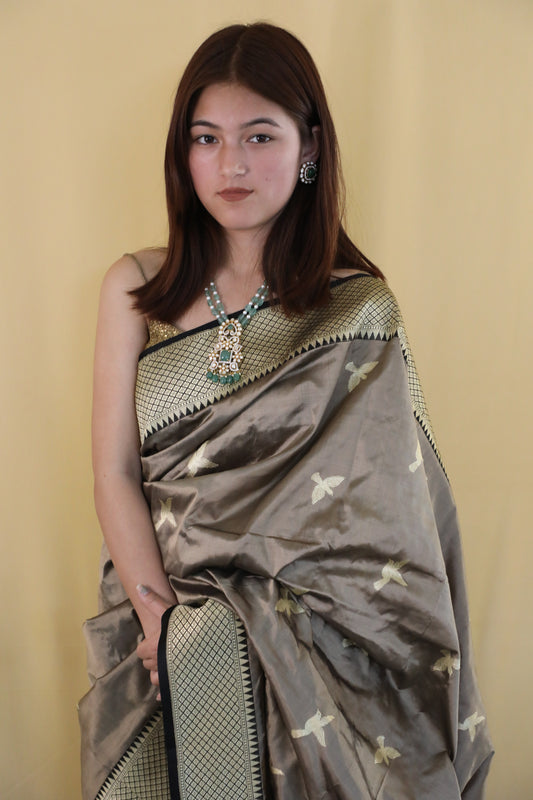 Taupe Suvarna Banarasi Katan silk saree with flying bird motifs

